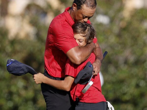 Charly y Tiger Woods